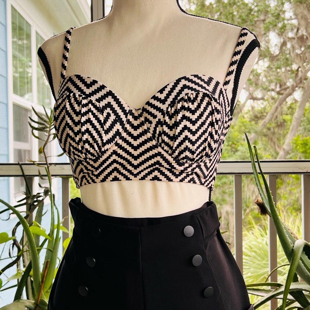 Like new. Xhilaration black and beige bikini top